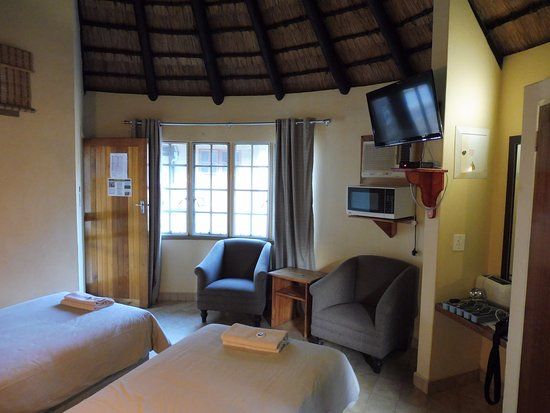 Inside a bungalow, with a kitchenette.